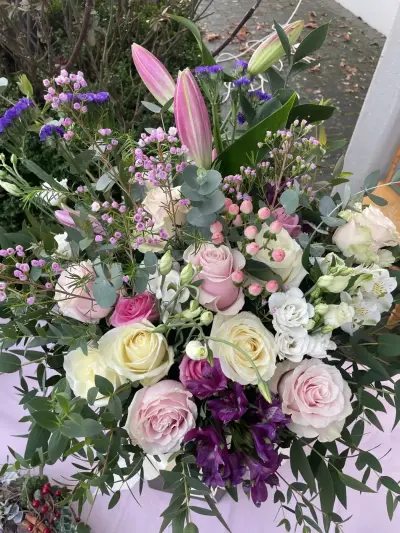 A soft pink and lilac bouquet with lilies