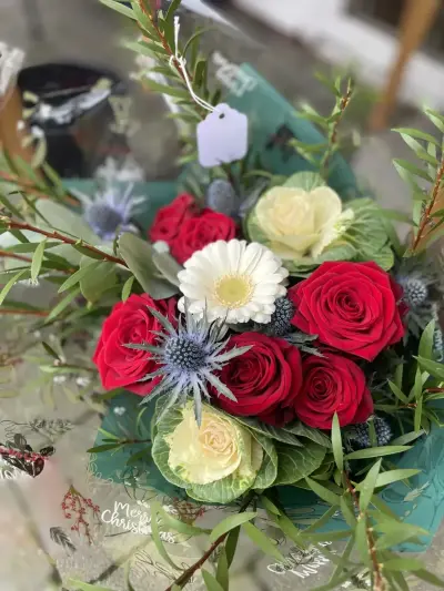 Red roses, gerberas and eucalyptus