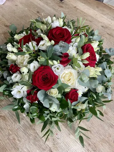 A round red rose and white lisianthus arrangement